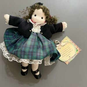 Green Tree Musical Doll, playing Flowers of Scotland. With tags, sun damaged.